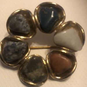 Vintage gold tone metal natural stones round pin.